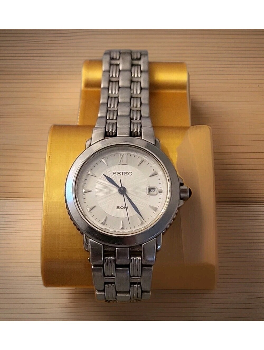 Seiko Silver Women's Stainless Steel Watch with White Dial and Blue Hands